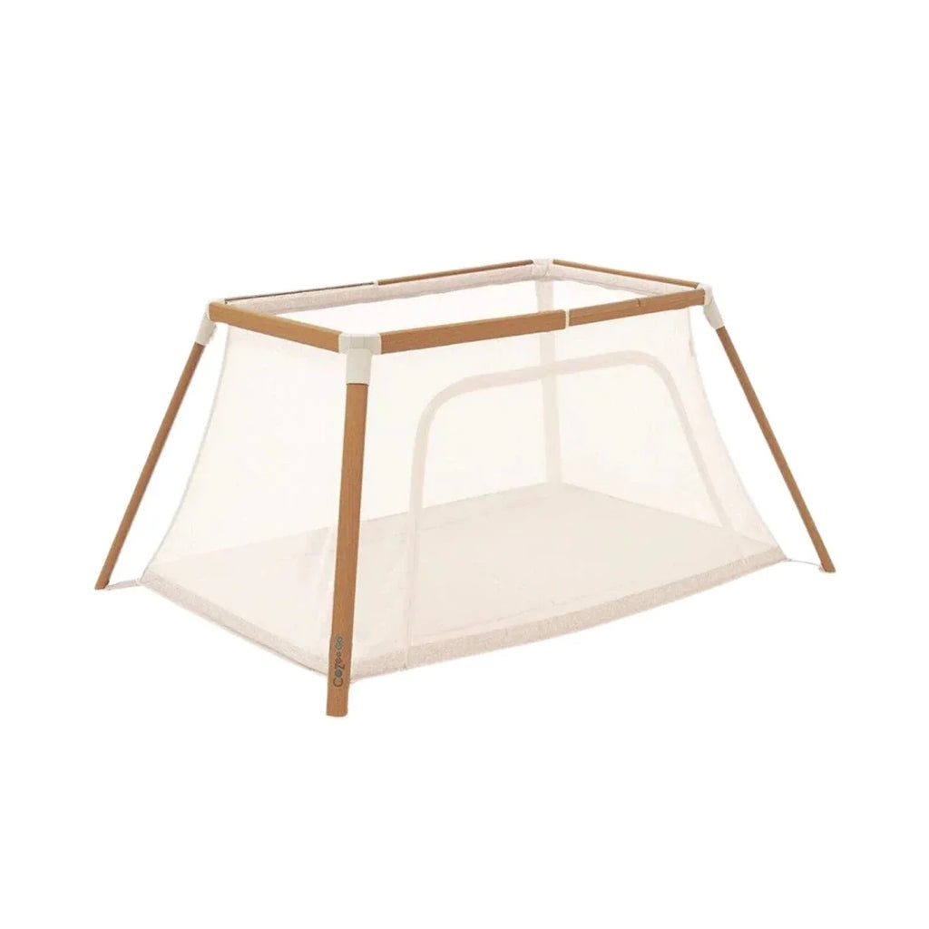 Tutti Bambini CoZee Go day-and-night playpen with light wood frame and ecru mesh panels