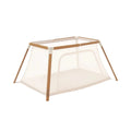 Tutti Bambini CoZee Go day-and-night playpen with light wood frame and ecru mesh panels