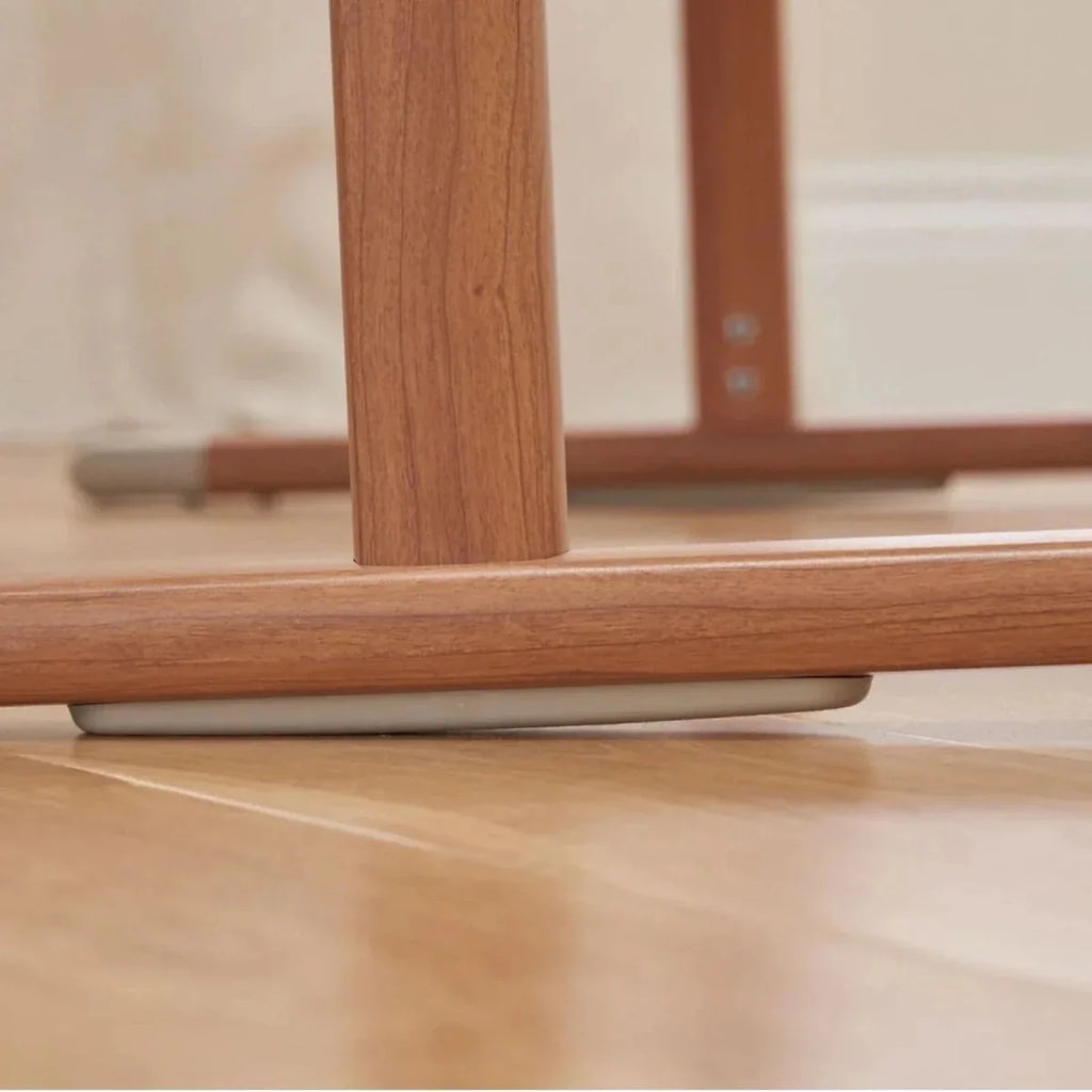 Walnut crib leg and support bar with beige base panel
