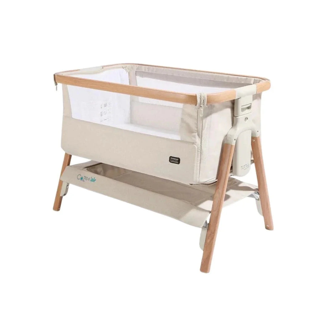 Scandinavian walnut and ecru bedside crib with mesh sides and fabric sleeping area