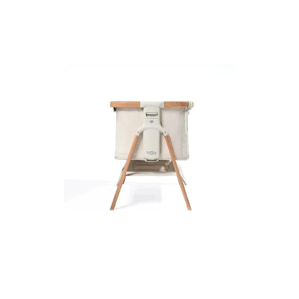 Ecru bedside crib with walnut stand and curved base supports