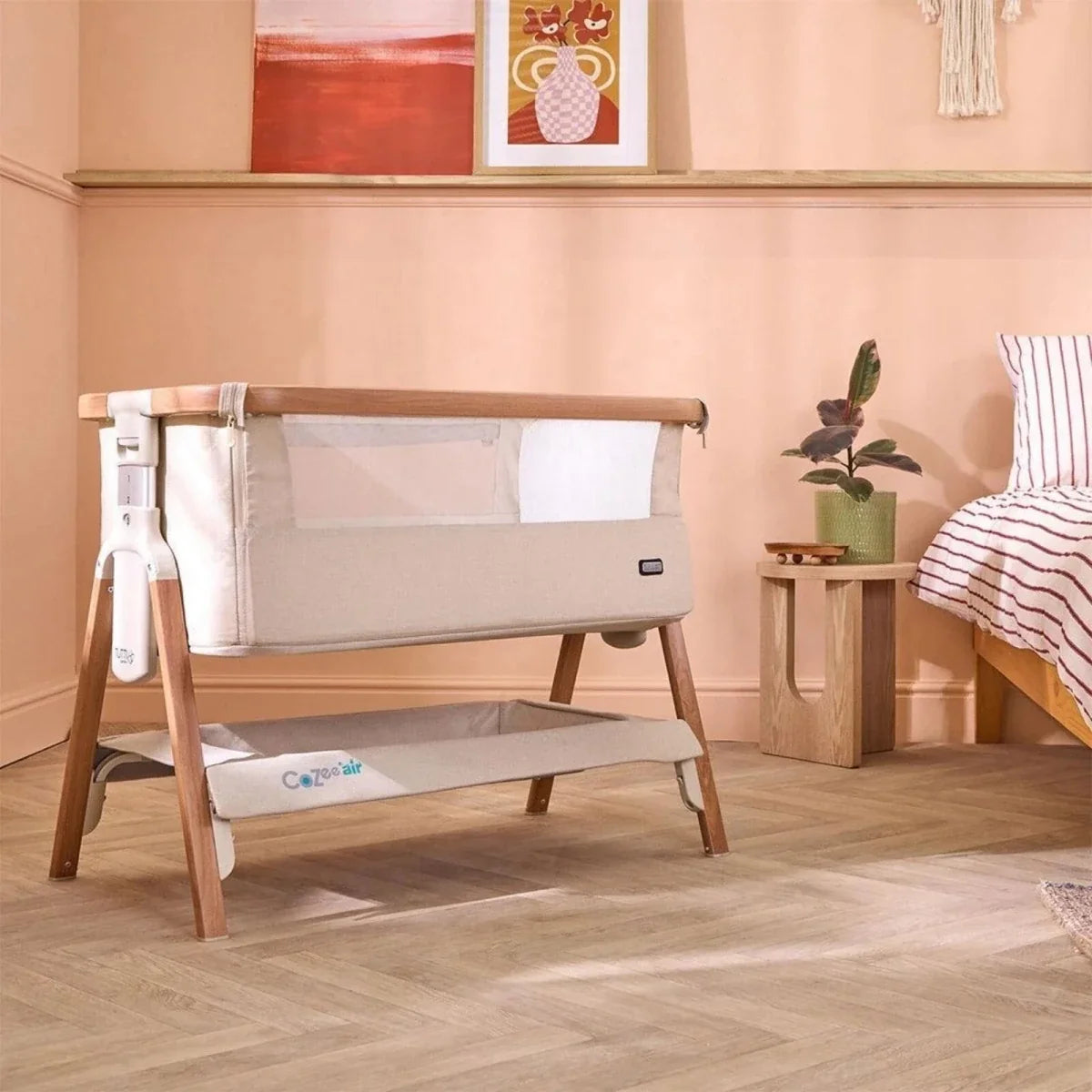 Ecru and walnut bedside crib with open side panel and two-tier base
