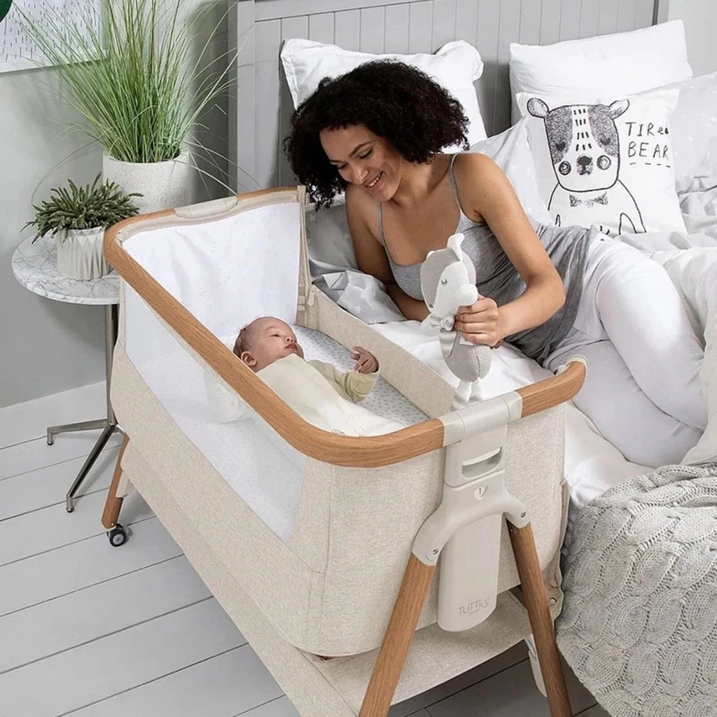 Scandinavian walnut and ecru bedside crib with bassinet attached on wheels