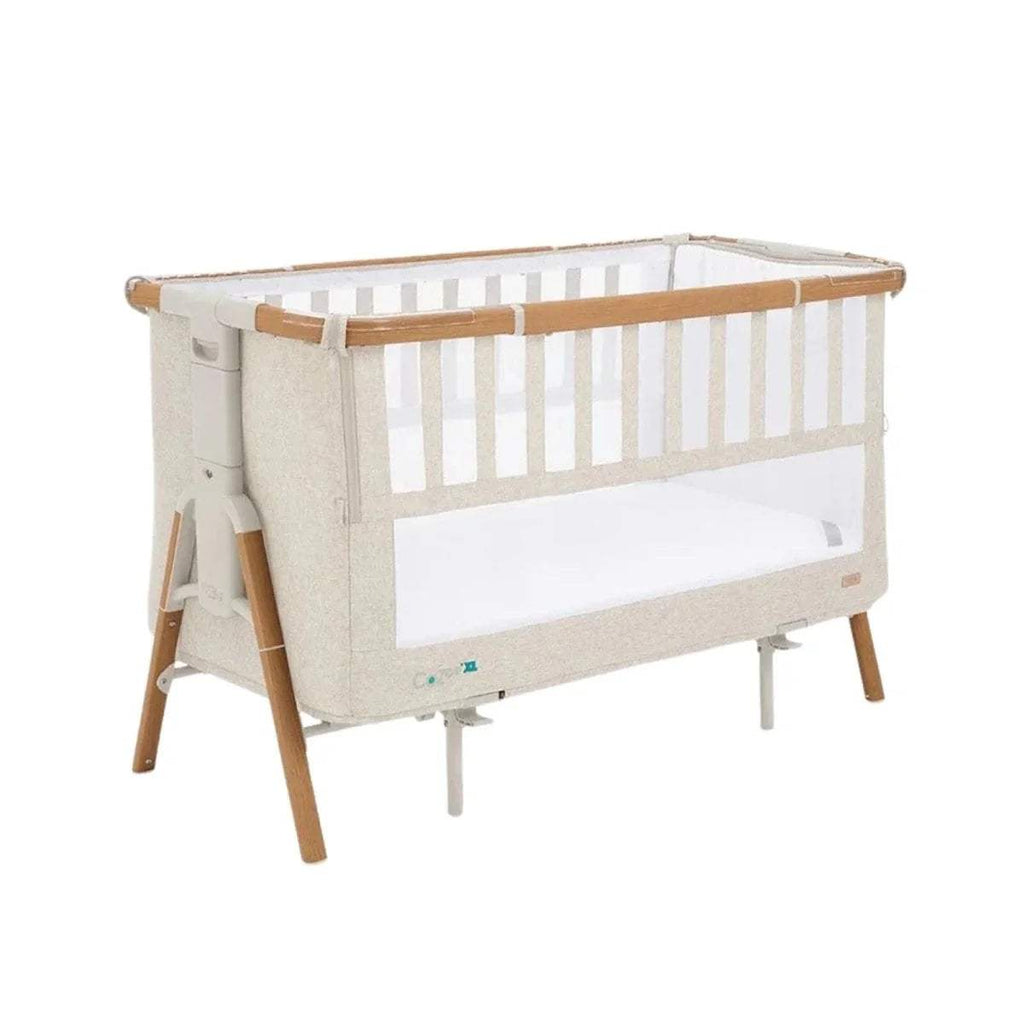 Scandinavian walnut and ecru bedside crib with mesh rail and open bassinet frame