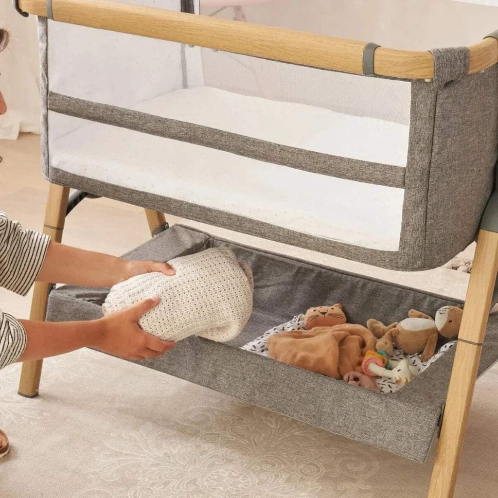 Grey and ecru bedside crib with wooden frame and open side bassinet