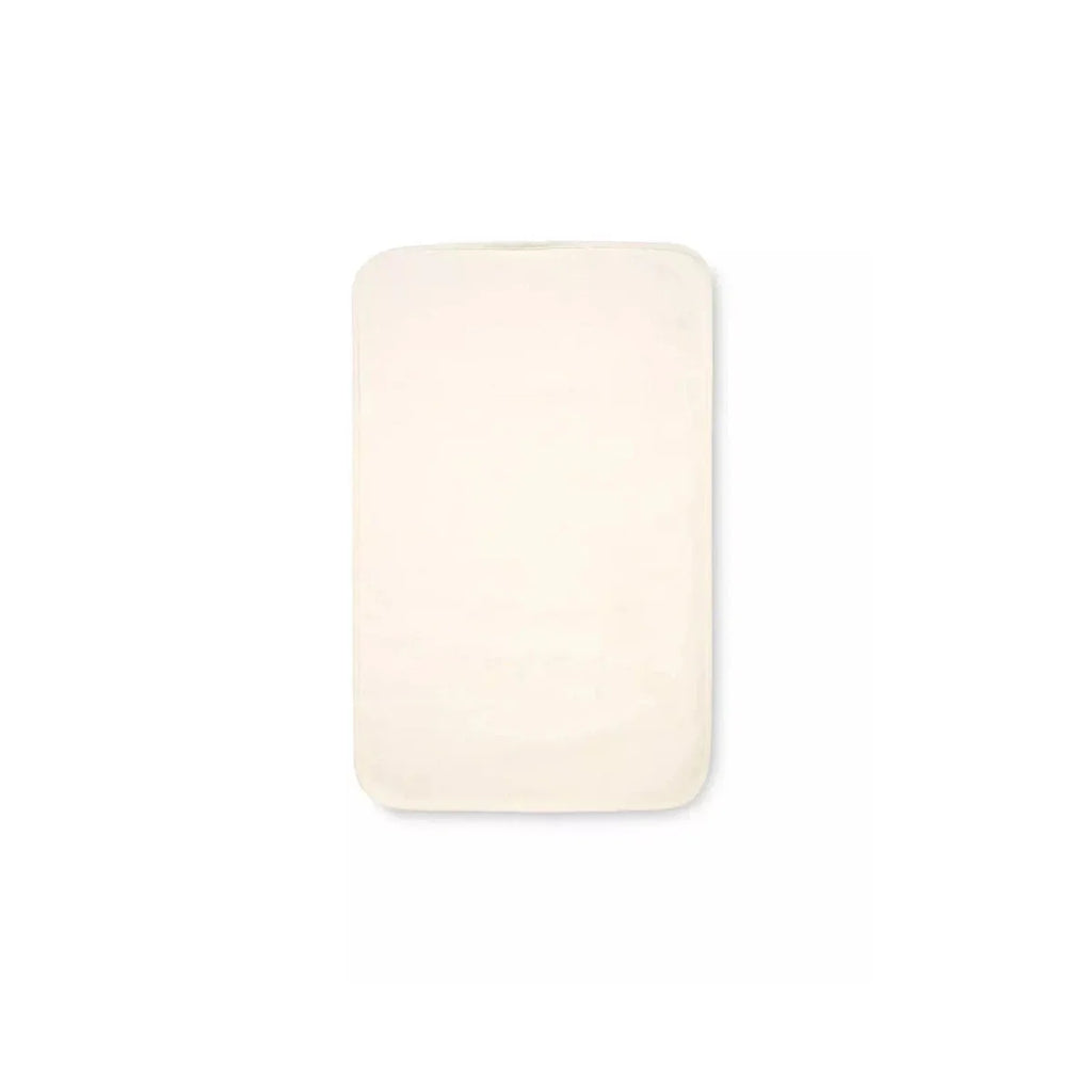 Cream mattress protector pad for bedside crib, rectangular with rounded corners.