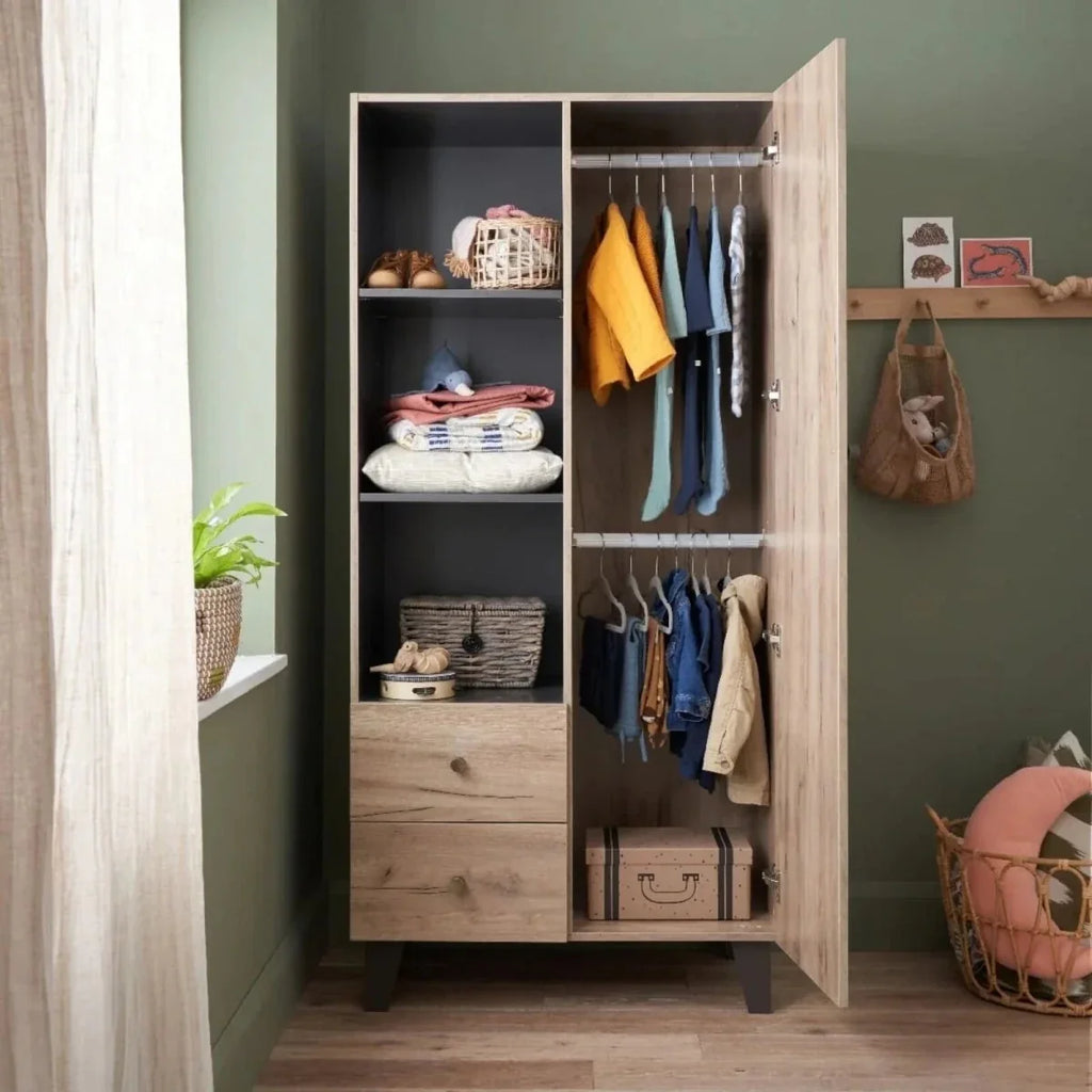 Child wardrobe cabinet with hanging rail, open shelves, and drawers in distressed oak.
