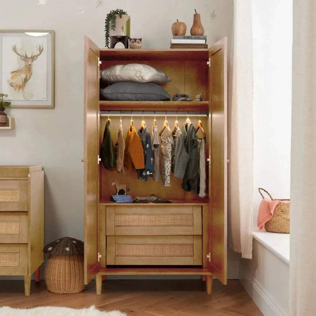 Light oak wardrobe open with hanging rail, shelves, and drawers