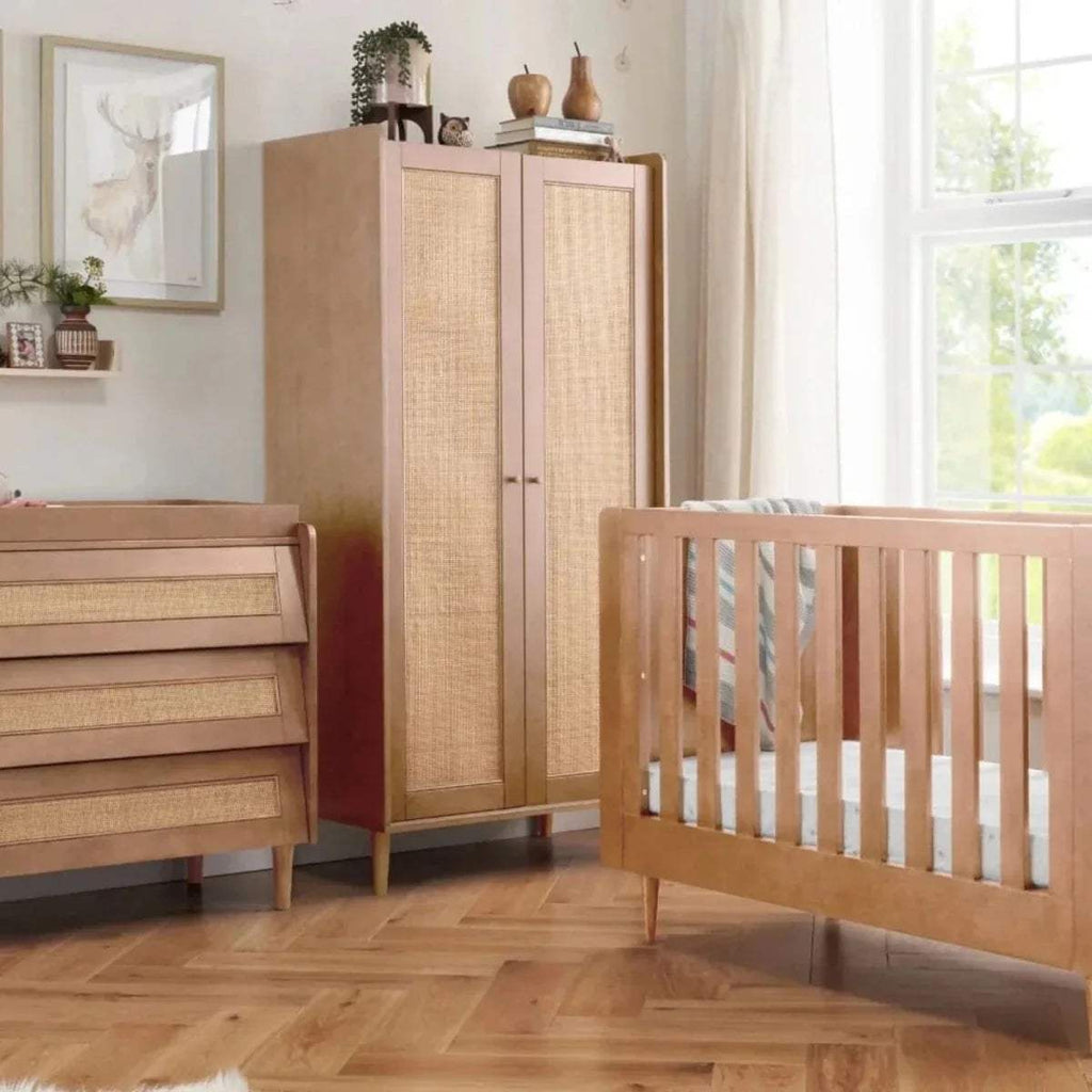Light oak wardrobe with two woven-panel doors and tapered wooden legs