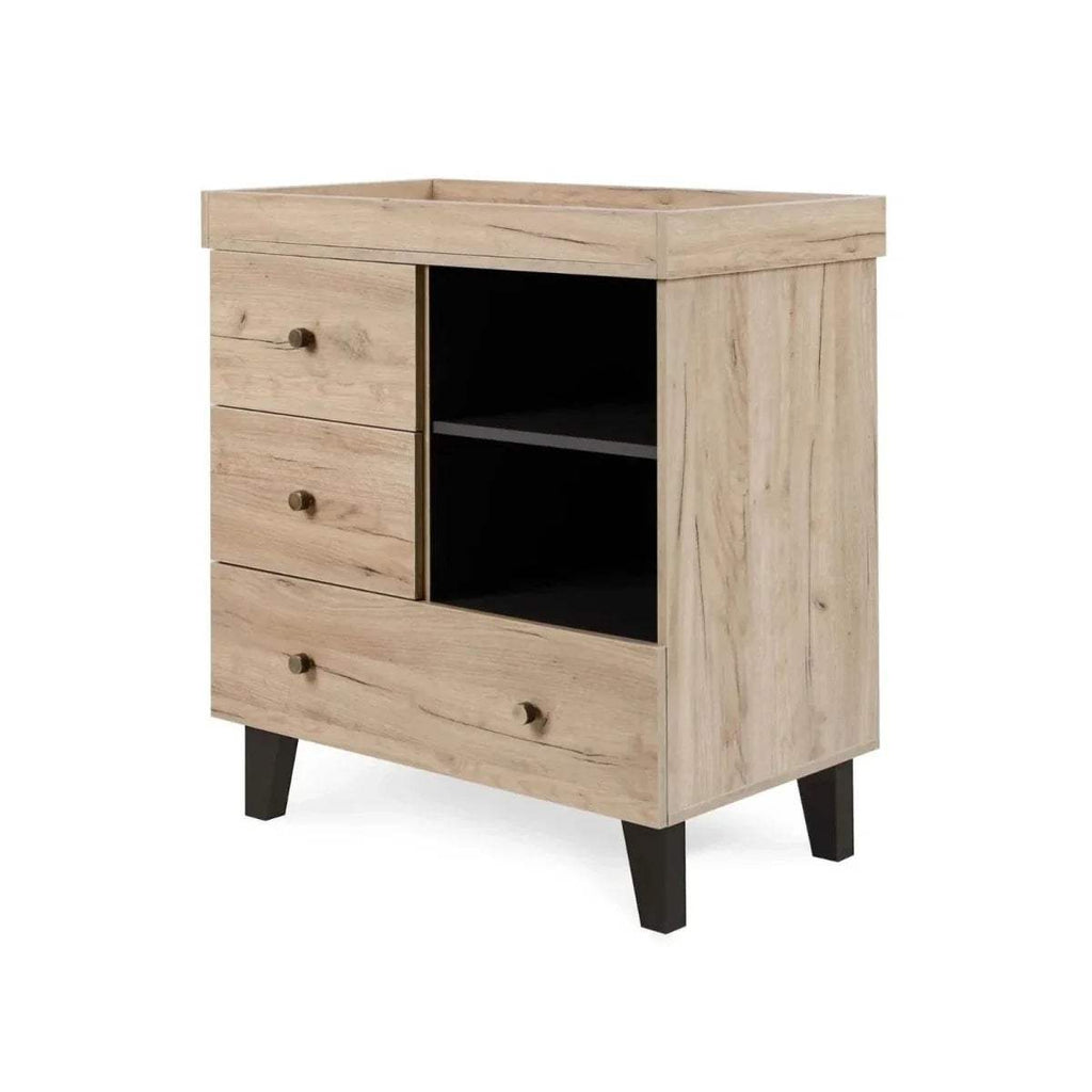 Baby changing chest with open center shelf, three drawers, light wood and dark legs