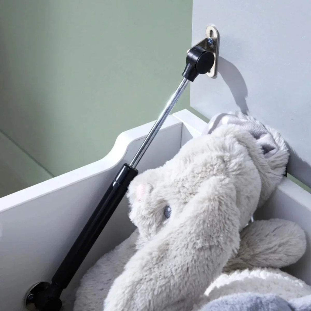 Toy box interior with white plush toy and dove grey back panel