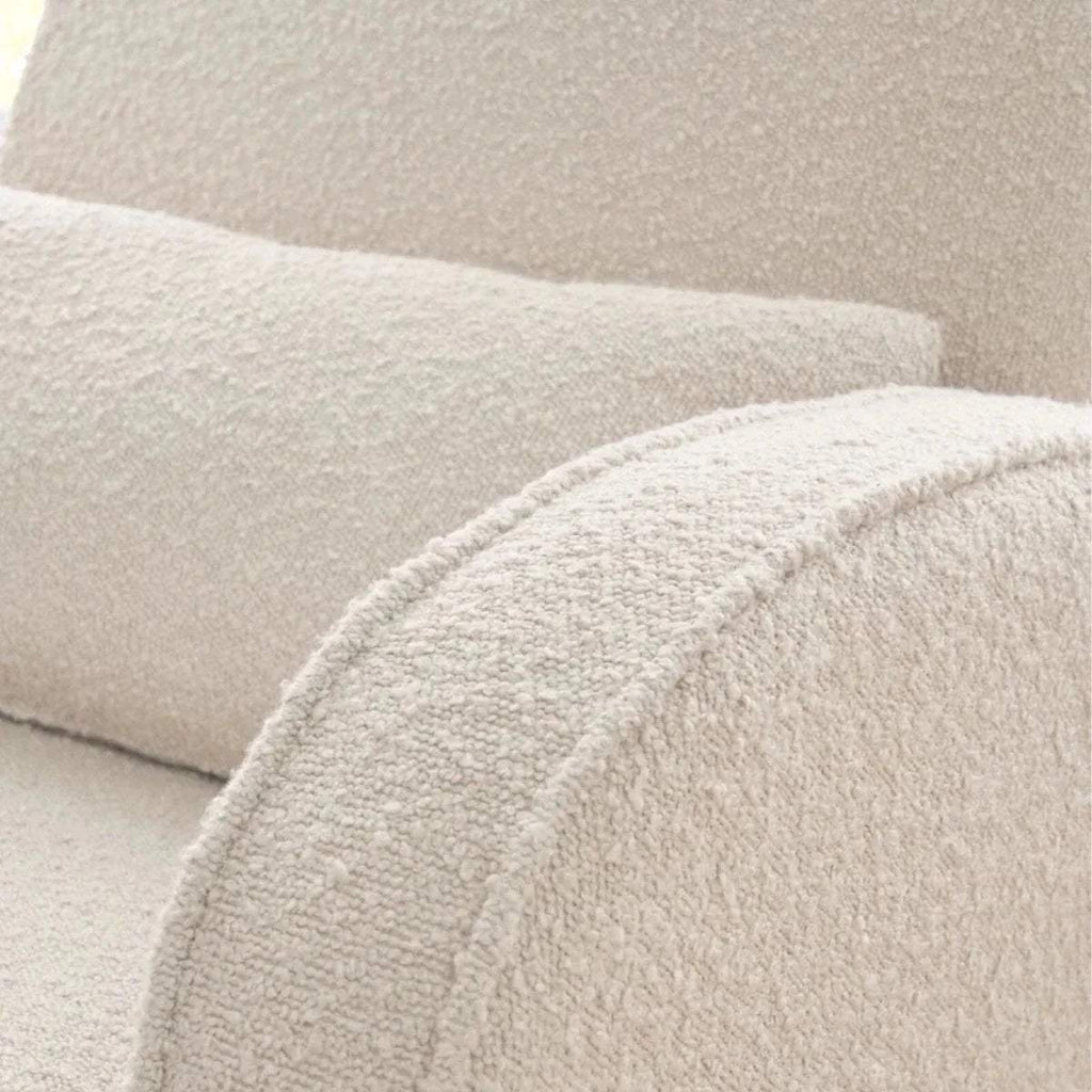 Fresh cream boucle fabric close-up on chair arm pad and seat cushion