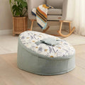 Baby beanbag with pale blue cover and ocean-themed print, rounded design with carrying handle.