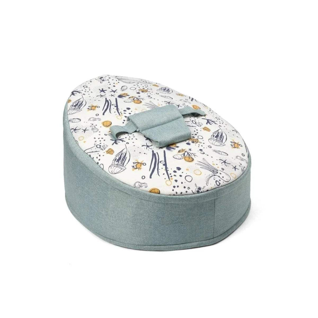 Round baby beanbag with pale blue fabric base and white ocean animal print top.