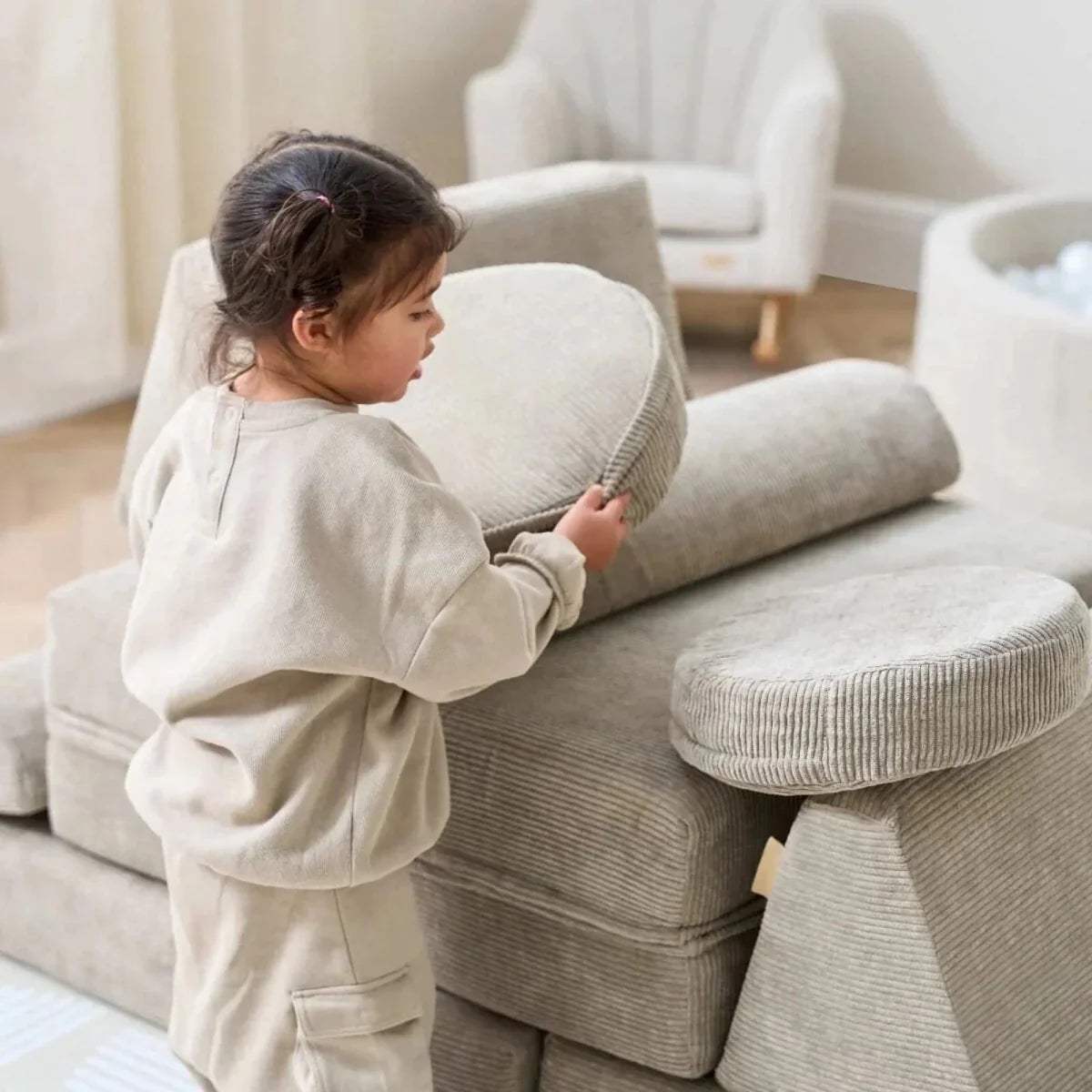 Close view of kids play sofa in mushroom-beige with rounded arm and seat cushion