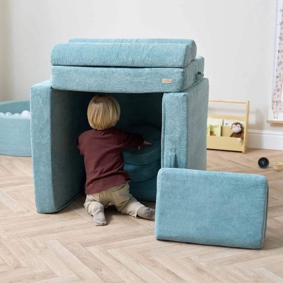 Teal kids play sofa with open front playhouse top and detachable step stool cushion