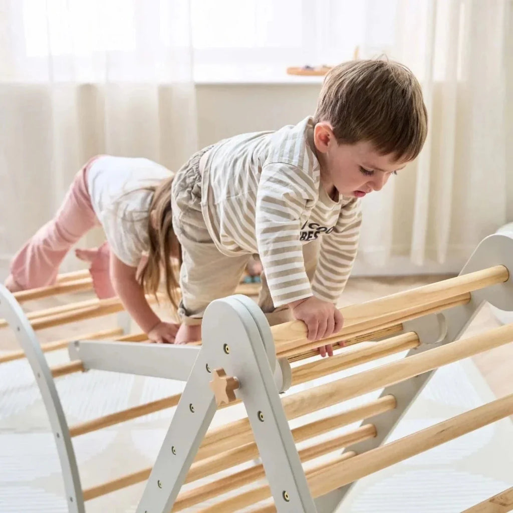 Montessori pikler climbing frame close view with gray ladder frame and wooden rungs