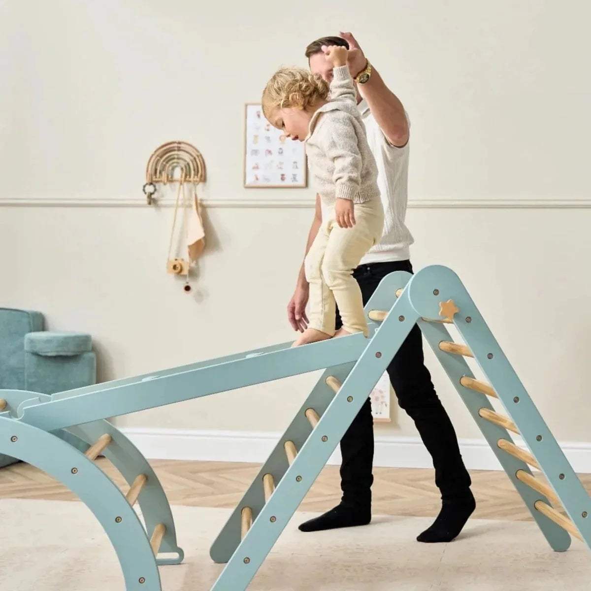 Pikler climbing frame with ocean stone A-frame and wooden rungs, child climbing