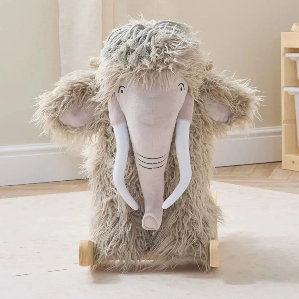 Gray plush woolly mammoth rocking toy with long tusks and carved wooden rockers.