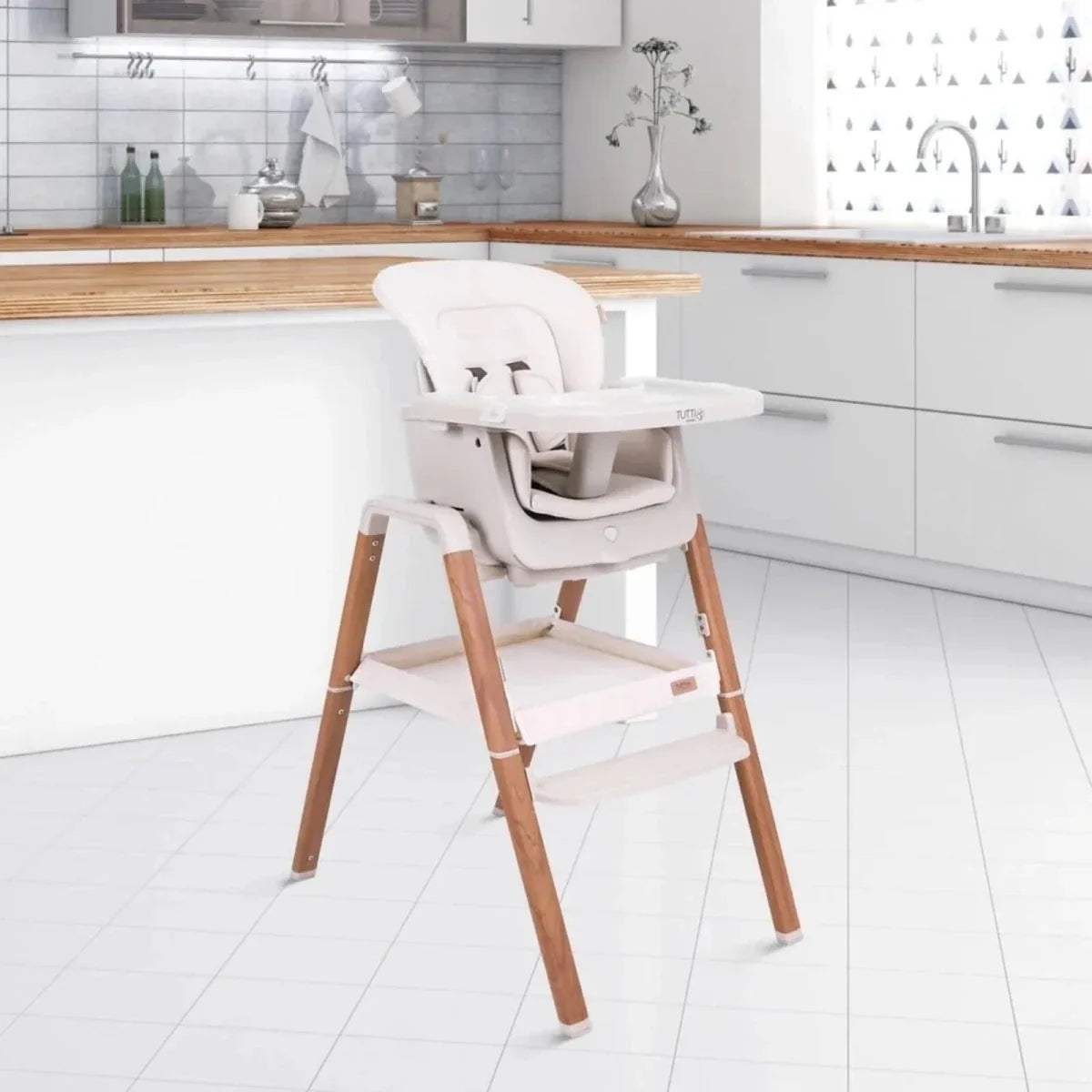 Tutti Bambini Nova highchair with ecru cushions and light wood frame, side view