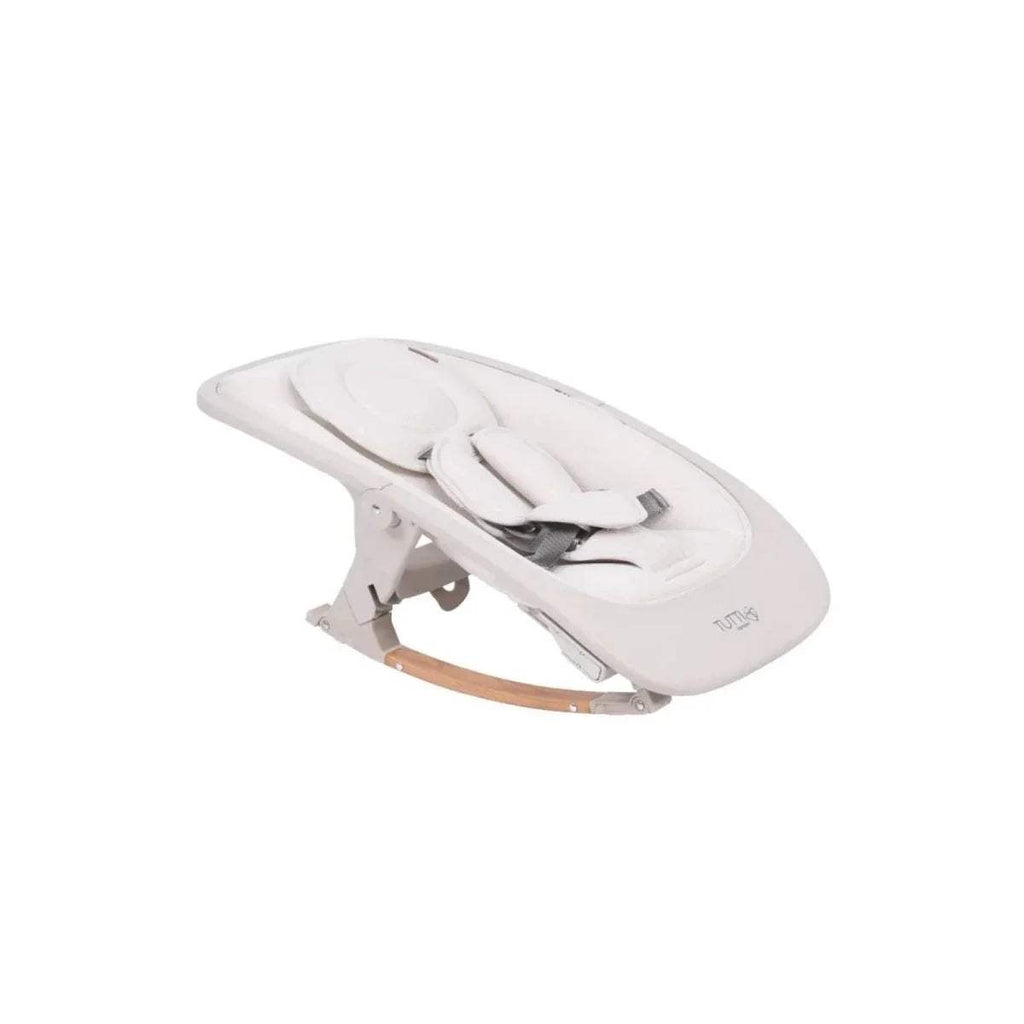 White highchair rocker seat with built-in harness and light wood base