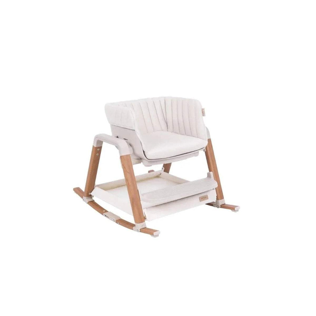 White high chair with cushioned seat, footrest, and light wood frame