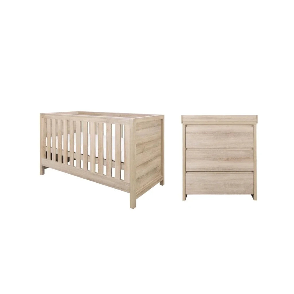 Light oak cot bed and matching dresser in a simple two-piece set.