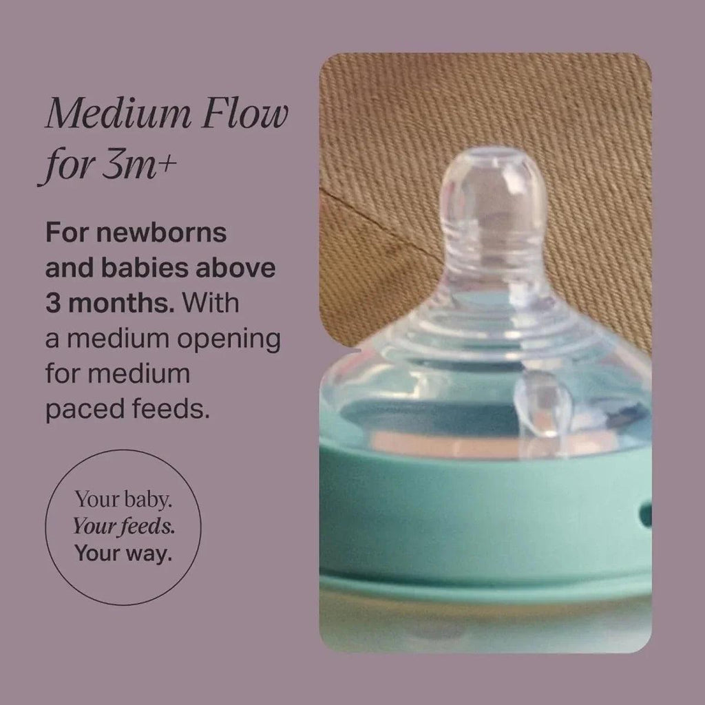 Baby bottle teat with medium-flow nipple shown on bottle top