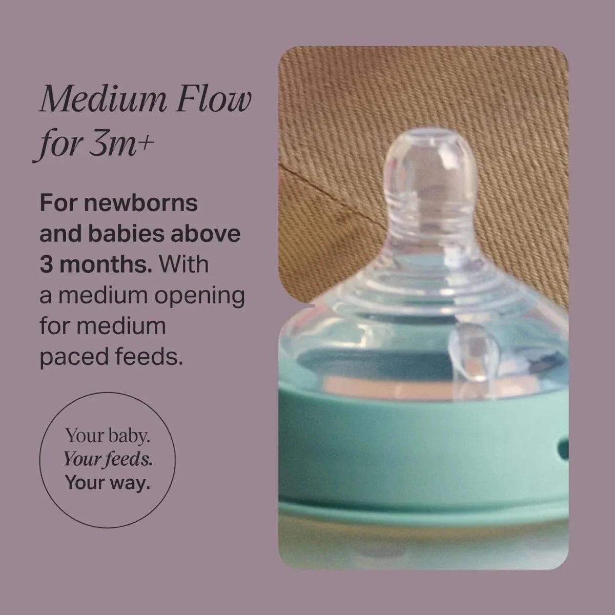 Baby bottle teat with medium-flow nipple shown on bottle top