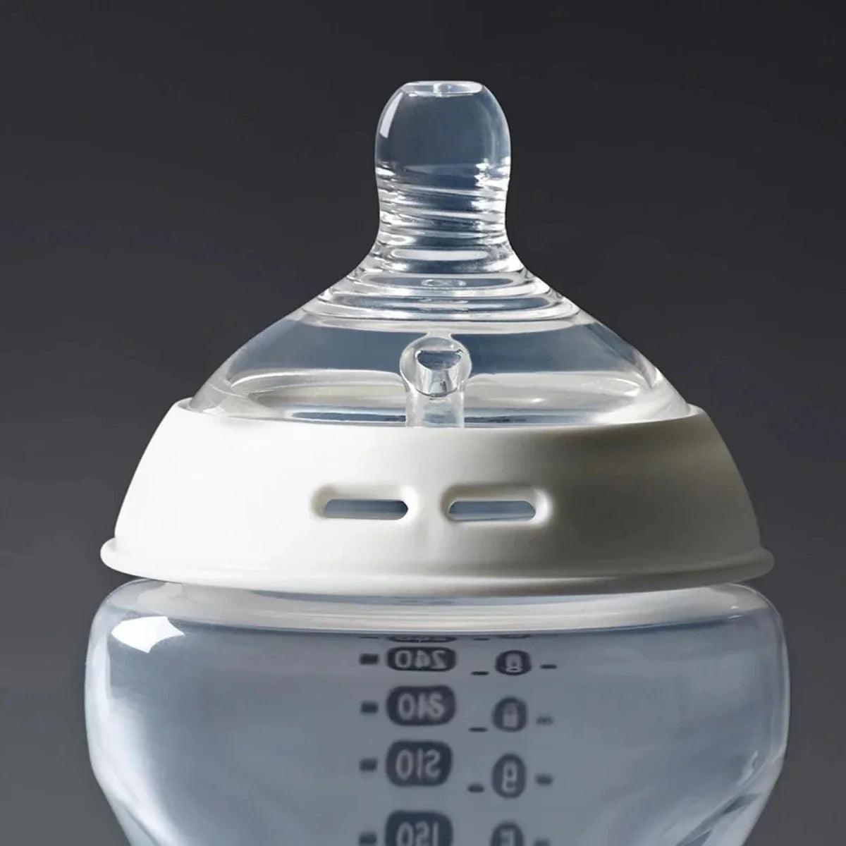 Clear silicone baby bottle teat with protective collar on bottle