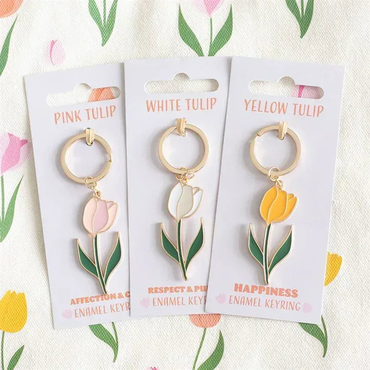 Set of three enamel tulip keyrings on cards: pink, white, and yellow tulip charms