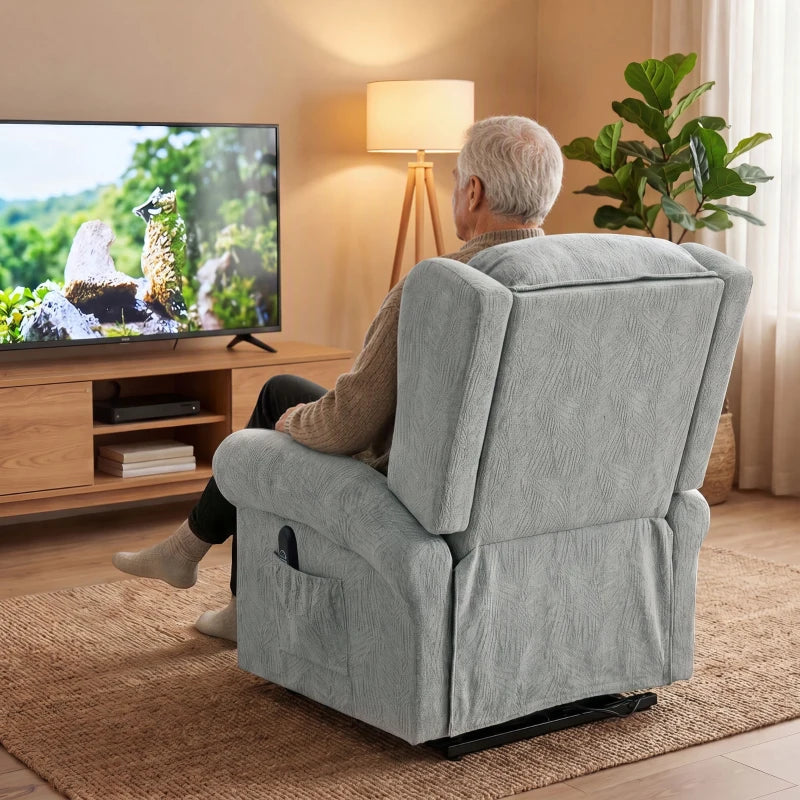 Grey recliner chair rear view with high back and padded headrest