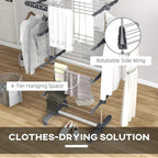 Grey four-tier clothes horse with rotatable side wing and hanging space, holding towels