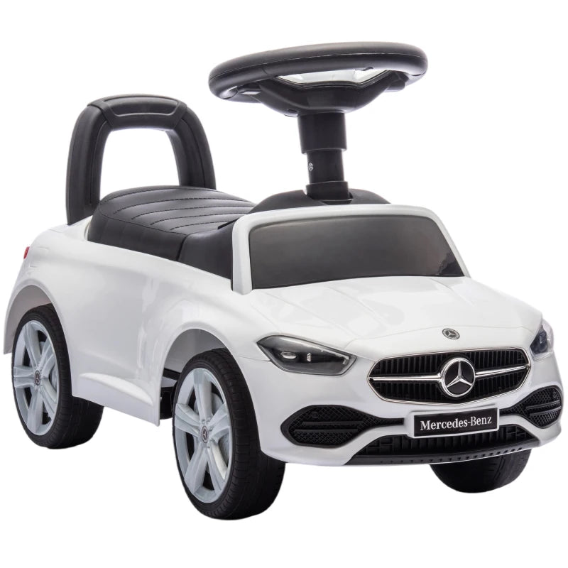 White Mercedes-Benz ride-on car walker with black seat, steering wheel, and front grille