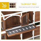 Two-tier wooden pet hutch interior featuring a slide-out cleaning tray