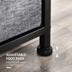 Adjustable foot pads under a dark grey fabric chest of drawers for stability