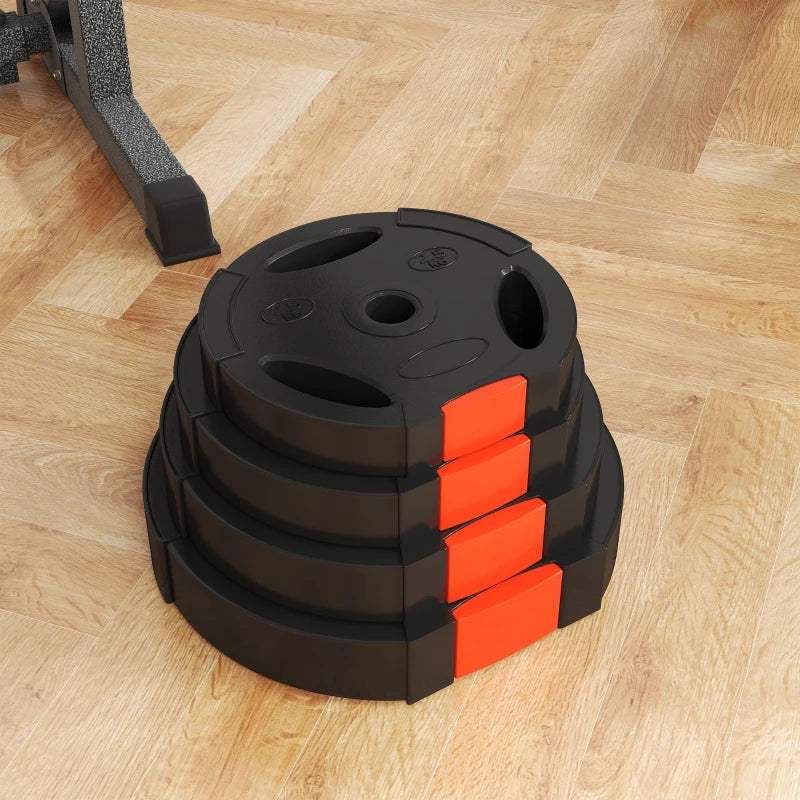 Stack of black weight plates with orange corner blocks, three top grip holes