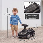 Matte black ride-on push car with seat and steering wheel, front three-quarter view