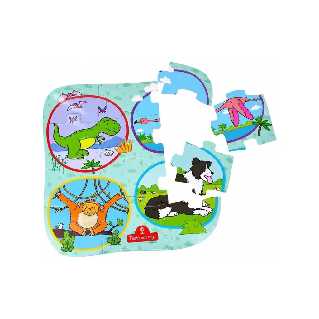 Animal floor puzzle mat with pieces removed, showing dinosaur, whale, and dog