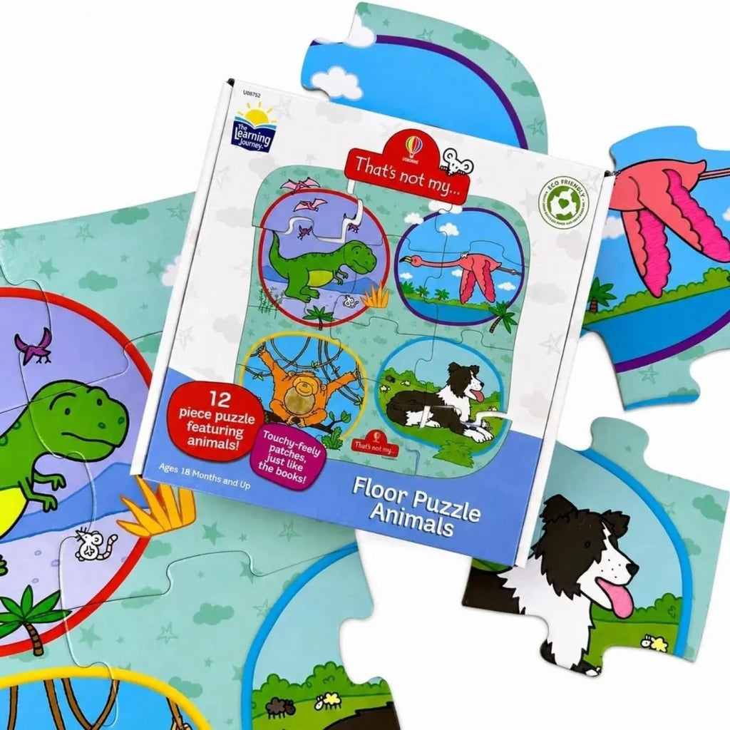 Boxed floor puzzle and separate animal jigsaw pieces with dinosaur and cat images