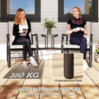 Two beige-cushioned gliding chairs with dark frames and small glass-top table