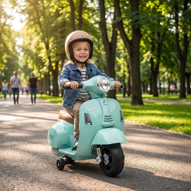 Green kids electric ride-on motorbike scooter with child rider, headlight, and front wheel
