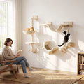 Beige wall-mounted cat furniture set with hammock, platforms, ladder and scratching posts