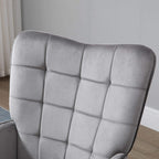 Grey wingback armchair back panel with square tufting and soft, padded upholstery