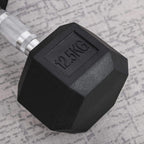 Black 12.5 kg rubber hex dumbbell head close-up with embossed weight