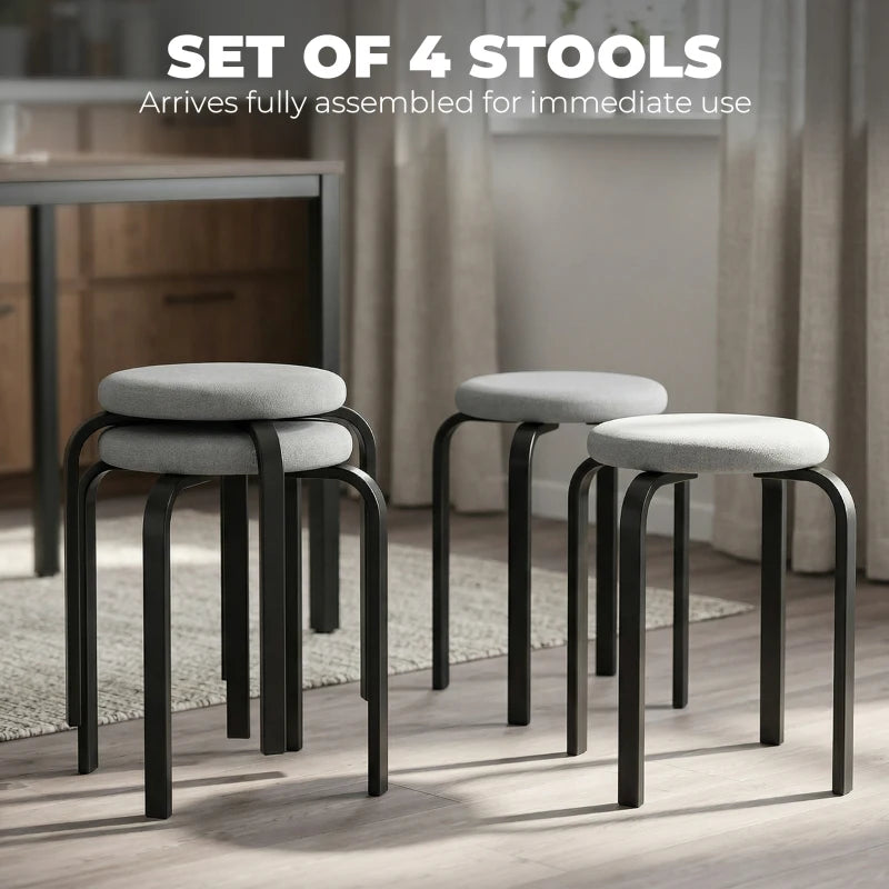 Set of 4 grey backless stools with round padded seats and black frames