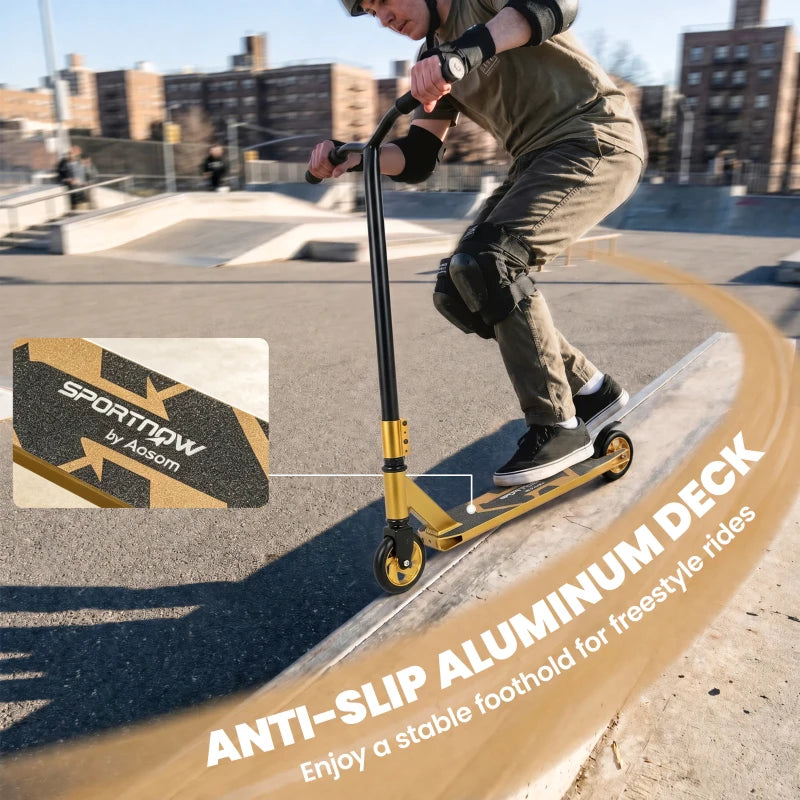 Stunt scooter with anti-slip aluminum deck and gold frame on a ramp