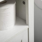 Close-up of white cabinet interior side panel and shelf edge with black hinge detail