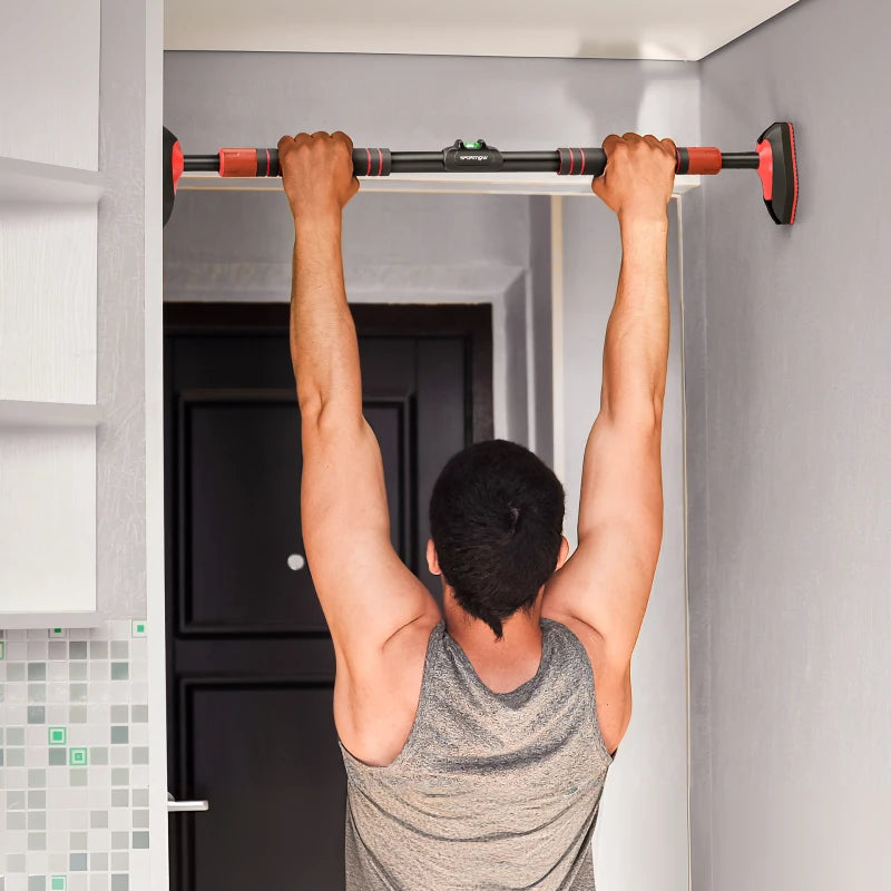 Man doing a pull-up on a red-and-black doorway bar with secure grips