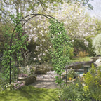 Black metal garden arch trellis with climbing vines near garden walkway